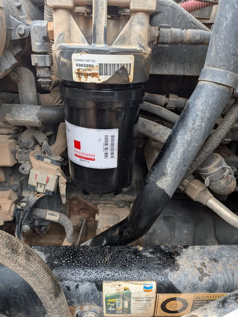 New fuel filter on a Cummins diesel during scheduled maintenance
