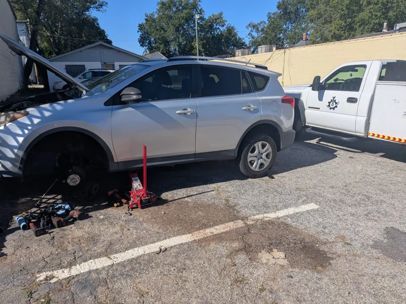 Front axle, hub and strut replacement on a Toyota RAV4, right in the parking lot
